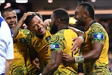 Marika Koroibete of the Wallabies (2nd right) reacts after scoring a try against New Zealand.