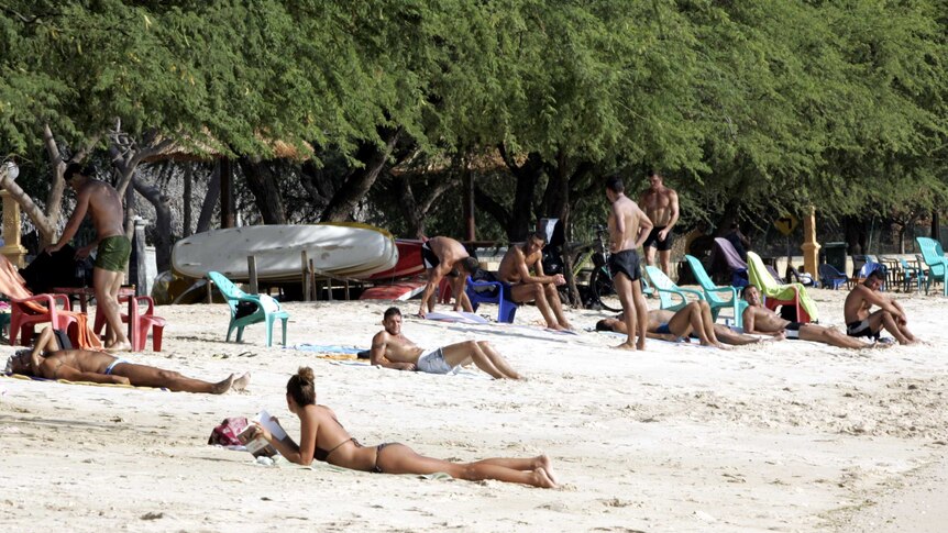 Tourists on a beach in Dili, East Timor
