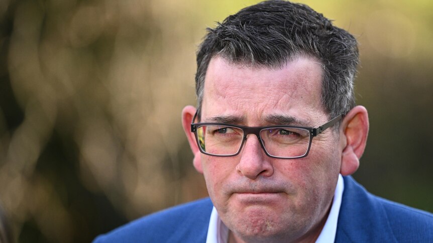 A close up shot of Daniel Andrews face during a media conference.