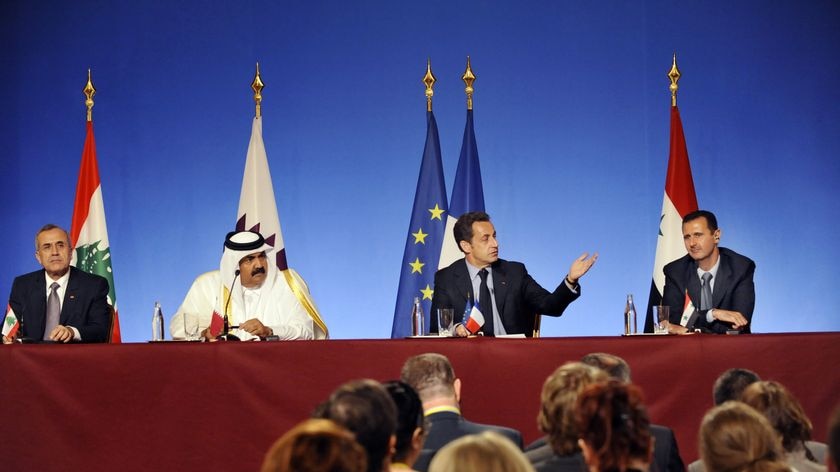 The leaders of Lebanon, Qatar, France and Syria sit side by side at a press conference