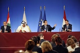 The leaders of Lebanon, Qatar, France and Syria sit side by side at a press conference