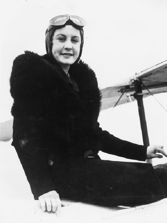A black and white photo of Ivy May Pearce wearing flying goggles.
