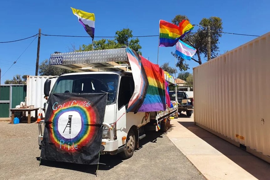 A truck decorated with pride flags 