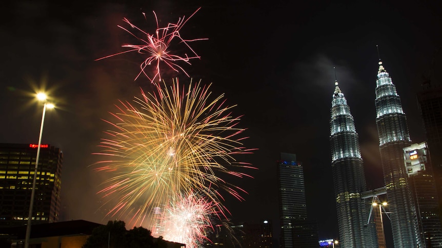 Fireworks explode in front of Malaysia's landmark building, Petronas Twin Towers for New Years celebrations in Kuala Lumpur.