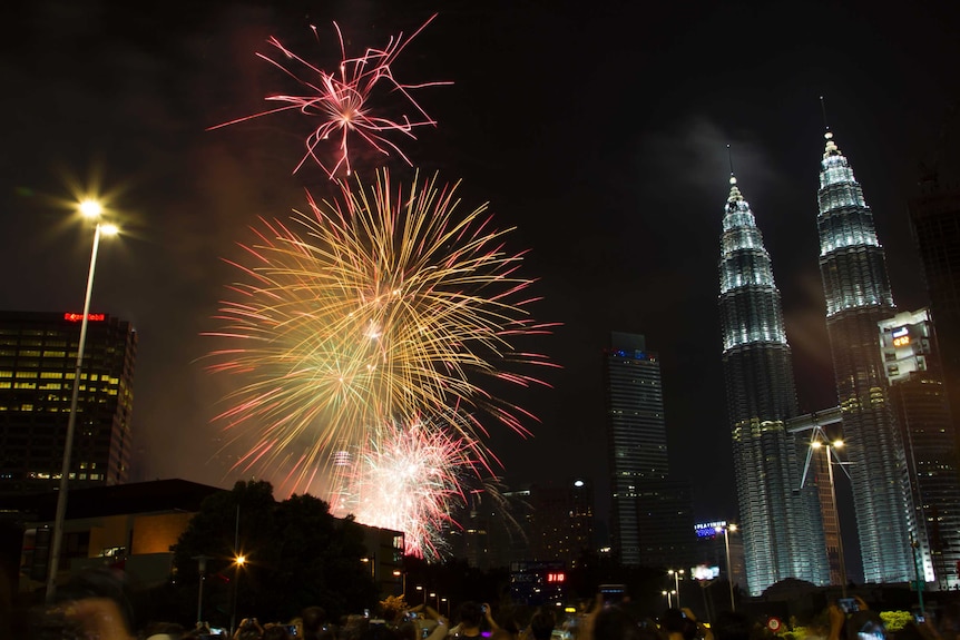 Fireworks explode in front of Malaysia's landmark building, Petronas Twin Towers for New Years celebrations in Kuala Lumpur.