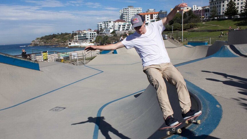 Mikey Mendoza skates off the edgy of the Bondi skate park ledge.