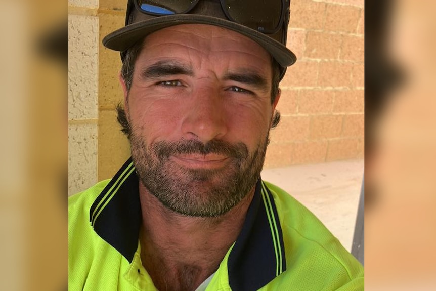 A man in high-vis posing for a selfie