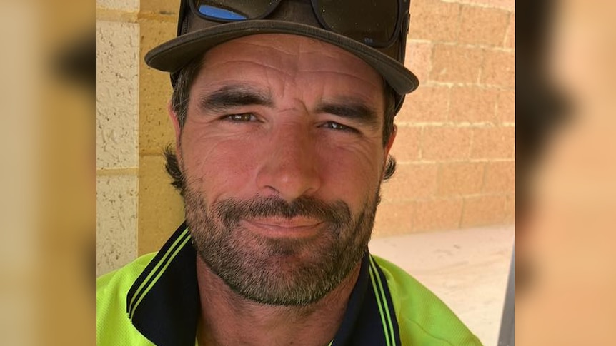 A man in high-vis posing for a selfie