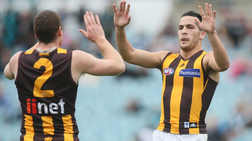 Shane Savage of Hawthorn (R) is congratulated by Jarryd Roughead after his goal at Football Park.