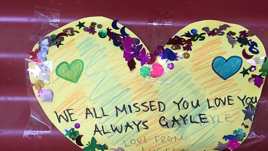 A heart-shaped note says Gayle Woodford will be missed and loved.