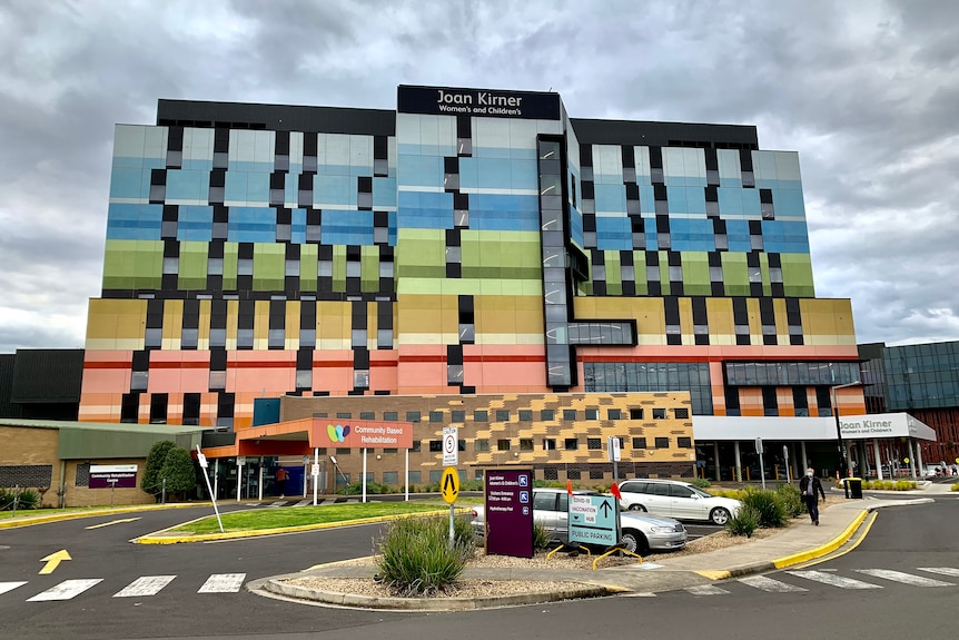The outside of the Joan Kirner hospital, with colourful blocks of colour marking the walls of each level of the hospital.