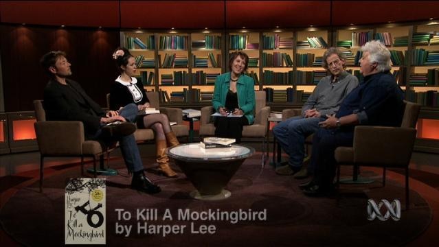 Jennifer Byrne and others sit on set of First Tuesday Book Club, text overlay reads "To Kill a Mockingbird by Harper Lee"