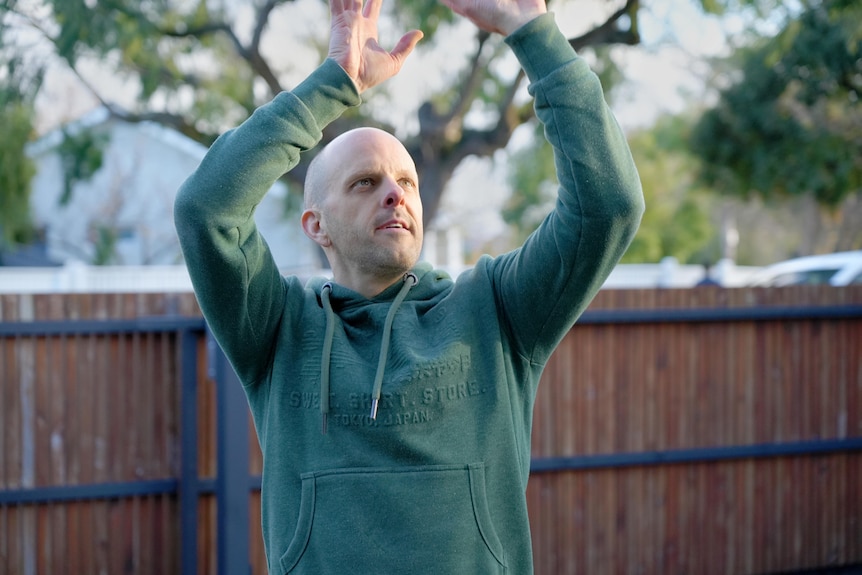 Tony shooting a basketball.