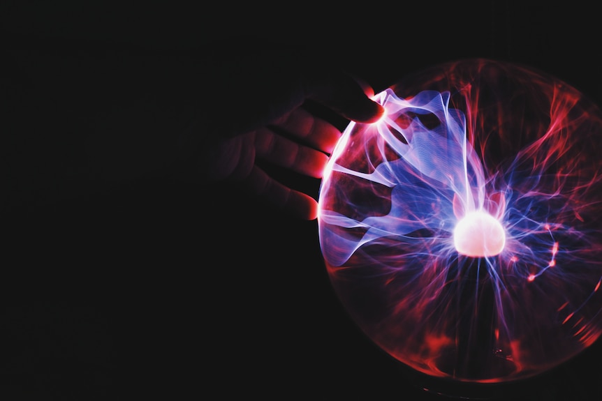 Person touching an electric orb.