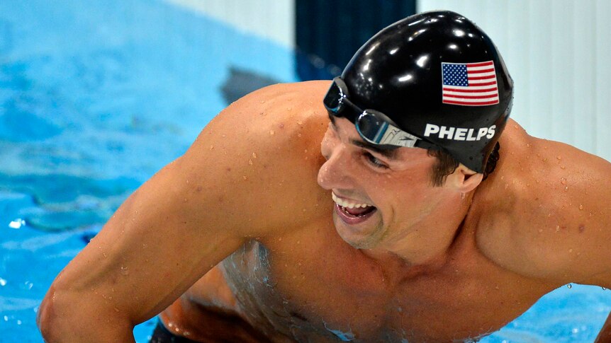 Michael Phelps of the US smiles after winning the 200m individual medley final.