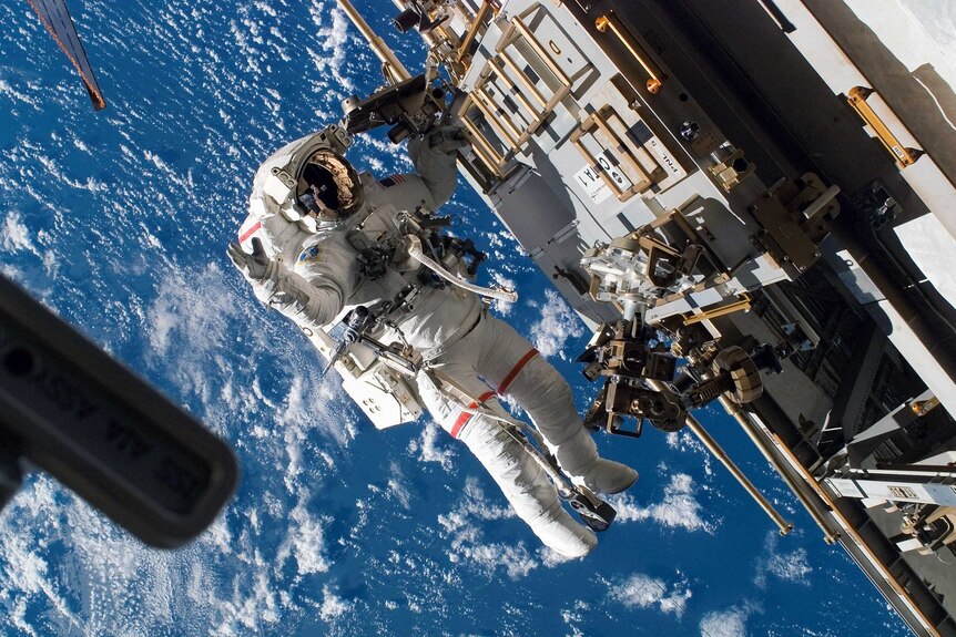Astronaut Rick Mastracchio performing maintenance on the International Space Station