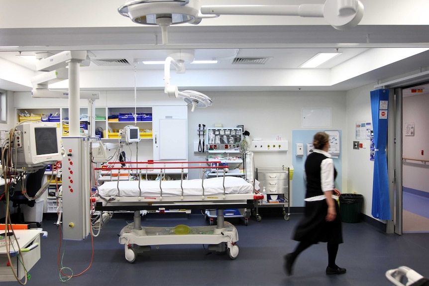 Emergency department at Mount Gambier Hospital, with a blurry, uniformed nurse heading out to the corridor 