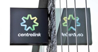 A Centrelink sign against a bright sky.