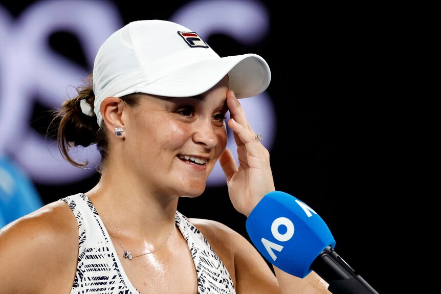 Tennis player Ash Barty giving what appears to be an emotional post-match interview.