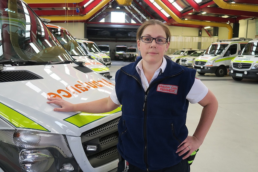 Lauren Hepher standing inside ambulance depot.