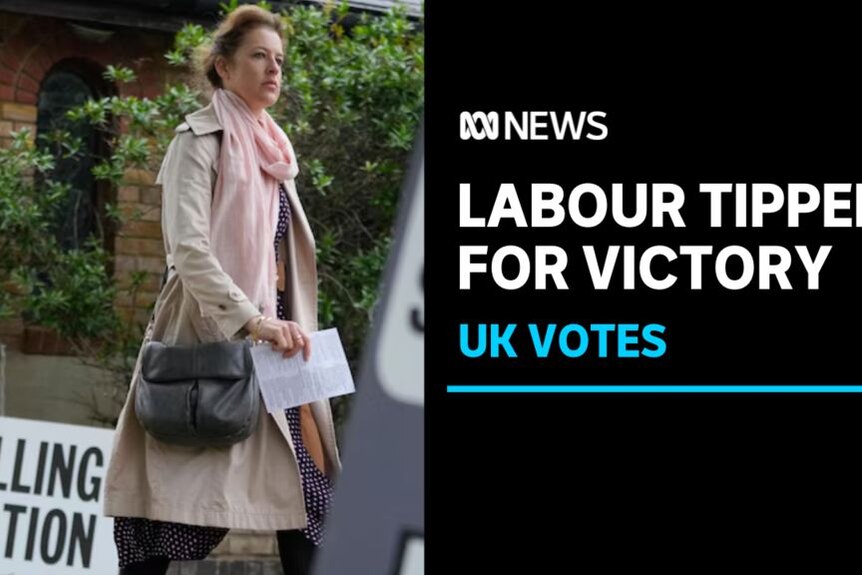 Labour Tipped for Victory, UK Votes: A woman walks past a sign which says 'polling station'.