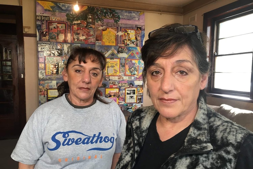 Rose Banks and Yvette Kelly stand in a room of the Gatwick rooming house in St Kilda.