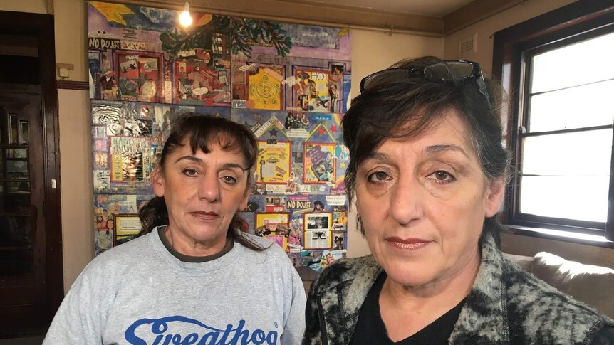Rose Banks and Yvette Kelly stand in a room of the Gatwick rooming house in St Kilda.