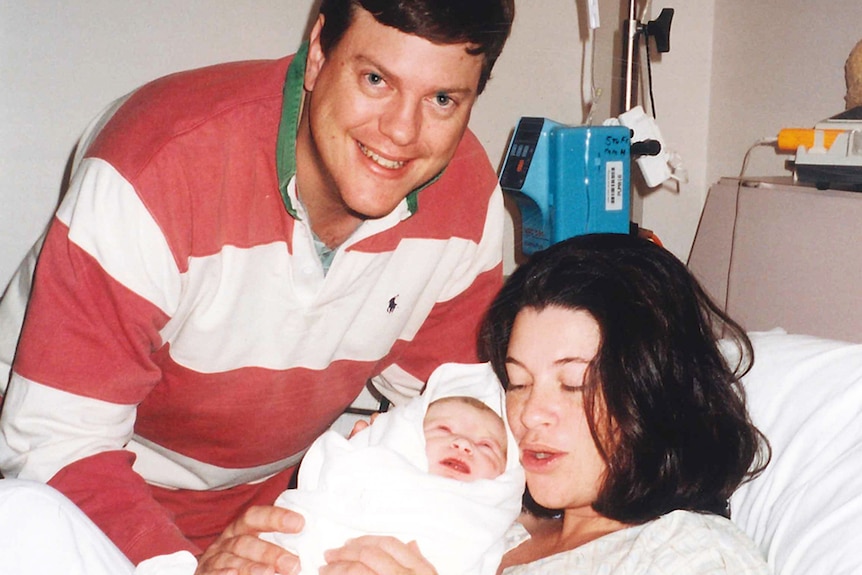 Tim Nicholls with wife Mary in hospital with firstborn son Jeremy on April 22, 1999