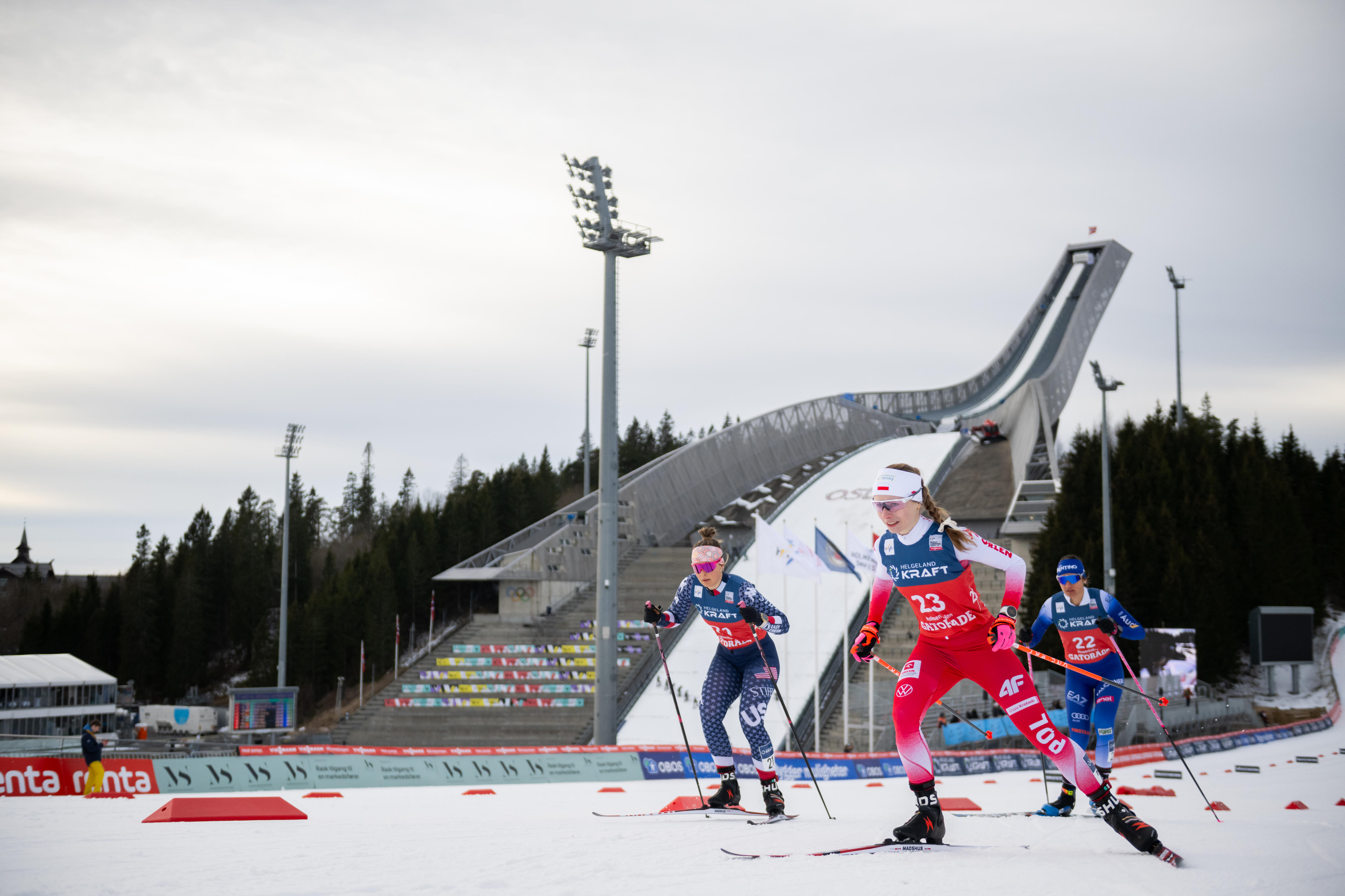 Annika Malacinski and Joanna Kil ski past the ski jump hill