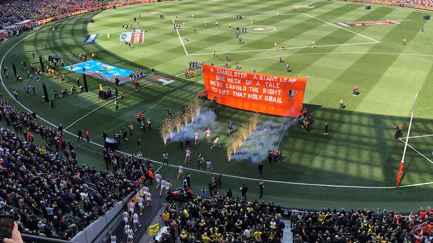 GWS run out onto the MCG for the AFL grand final