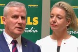 Michael McCormack speaks at a microphone while Bridget McKenzie looks on.
