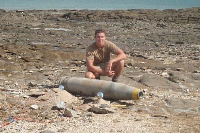 A man poses with a bomb