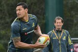 Ob debut ... Israel Folau trains under the watchful eye of Robbie Deans