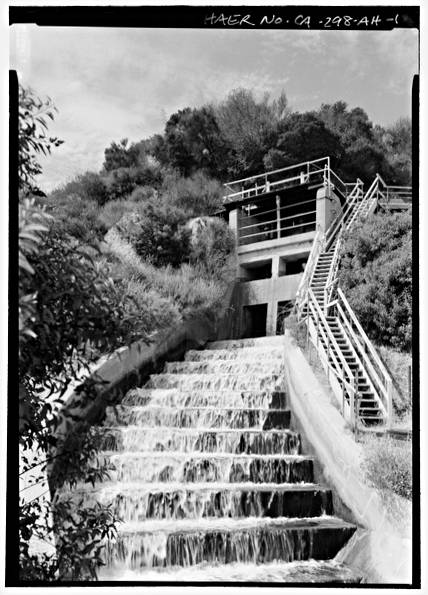 Black and white photography of water cascading down stairs waterfalls