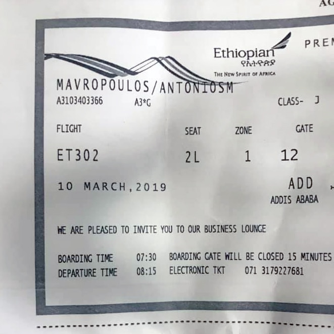 A printout for boarding Ethiopian Airlines flight 302 showing the seat number and boarding time.