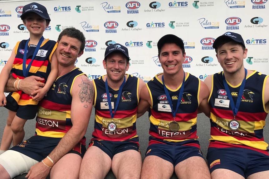 Leeton Whitton teammates smiling after winning the 2017 AFl Riverina premiership