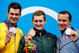 Cameron van der Burgh, Christian Sprenger and Brendan Hansen with their medals.