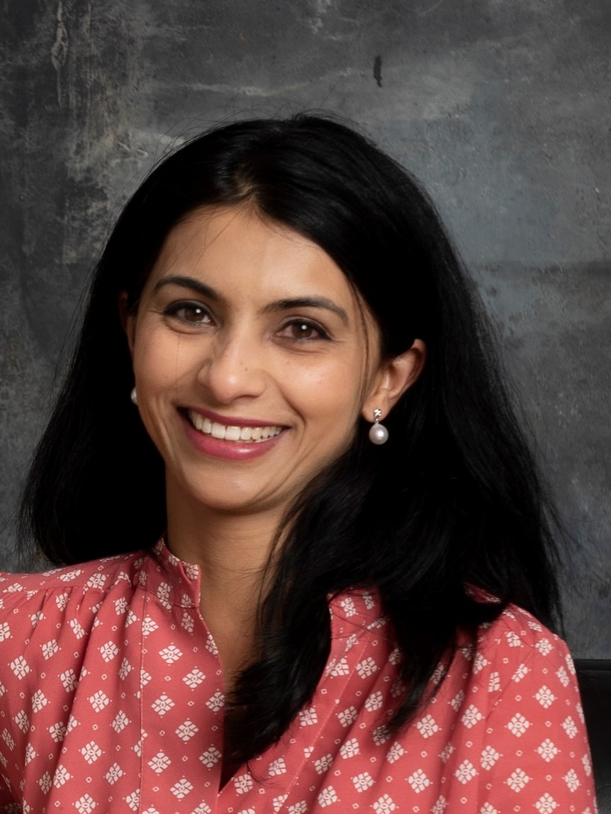 Shreya McLeod, an expert in sport-related concussion, smiles at the camera