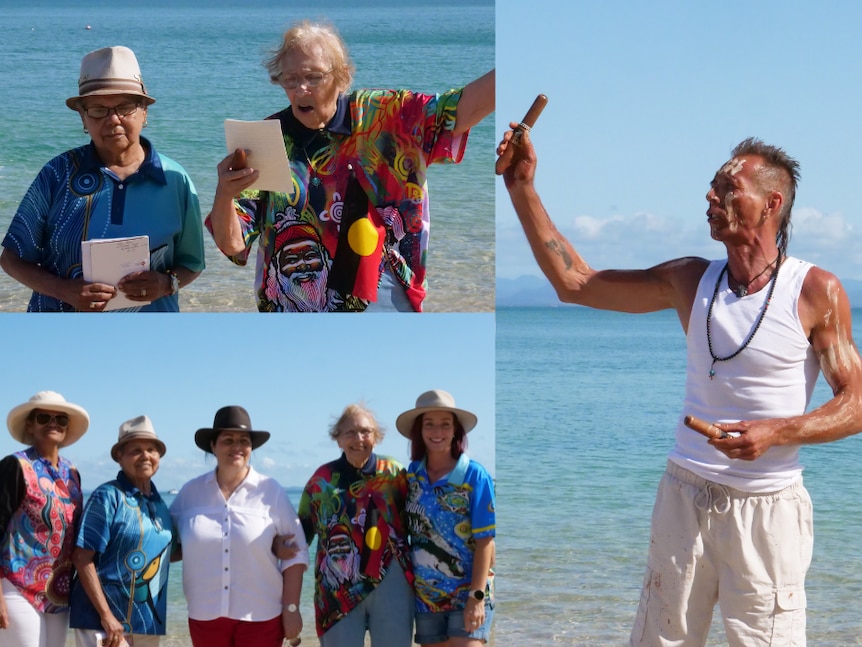 Two Woppaburra women stand on a beach and read from a piece of paper