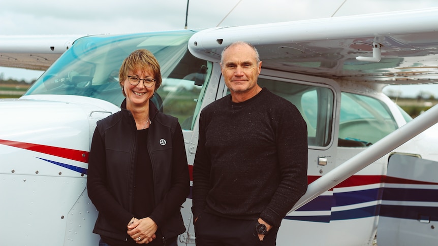 Pilot Jenny Schmidt and Photographer Andrew Halsall in front of a Cessna 172 aeroplane