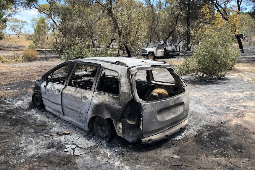 Burnt out car in bushland