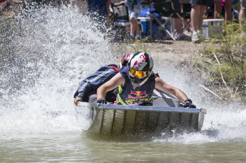 Competitors race in the 2015 Dinghy Derby leaving water spray in their wake