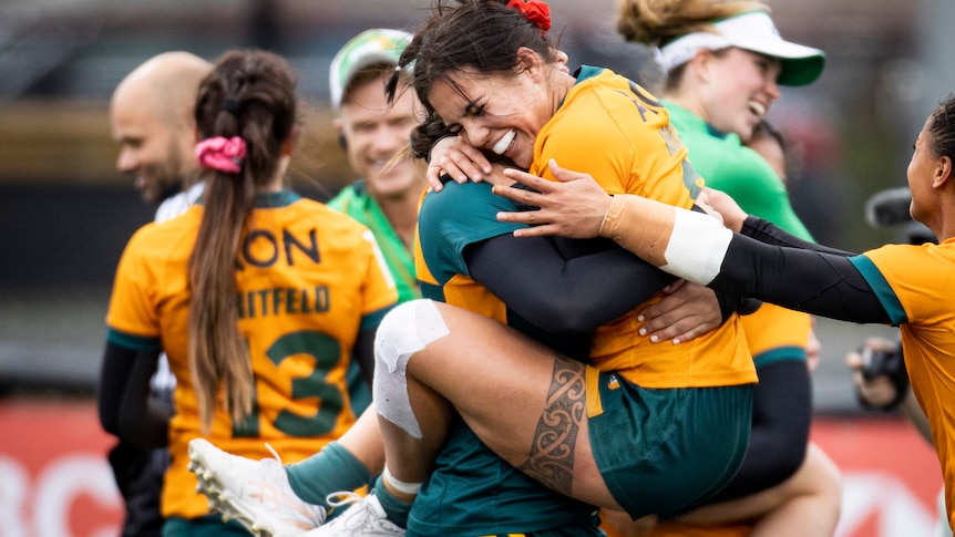 A womens rugby player celebrates victory in a world sevens match 