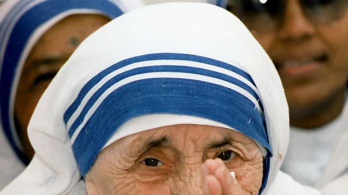 Mother Teresa greeting people at the Missionaries of Charity For Destitute Children in New Delhi in 1997.