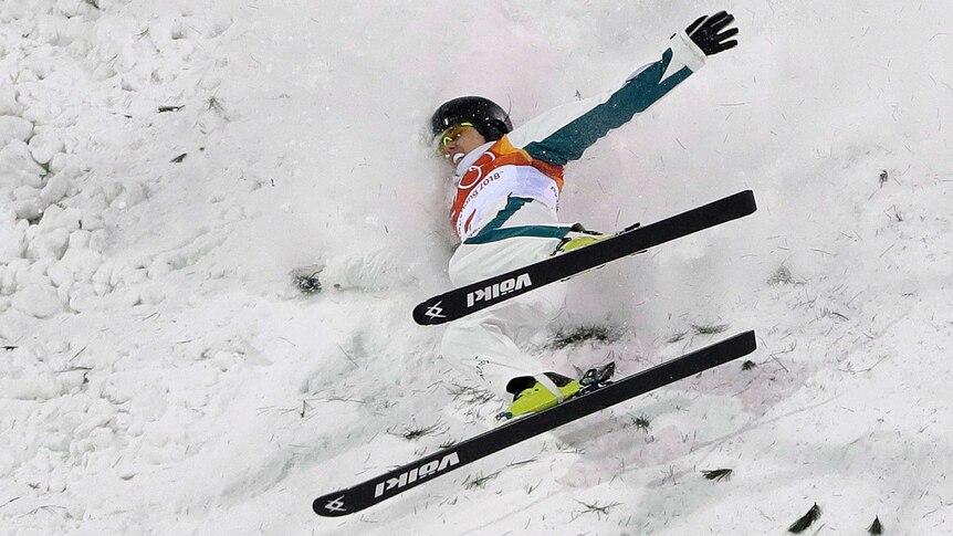 Laura Peel crashes into the snow in the women's aerials super final at the Olympic Winter Games.
