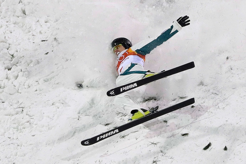 Laura Peel crashes into the snow in the women's aerials super final at the Olympic Winter Games.