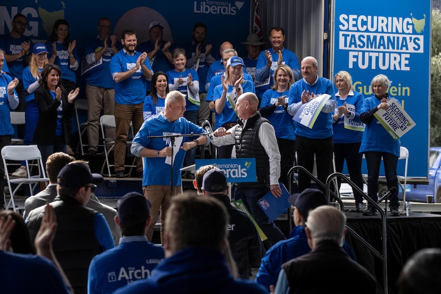 Jeremy Rockliff and Peter Gutwein bump elbows at Tasmanian Liberal election campaign launch