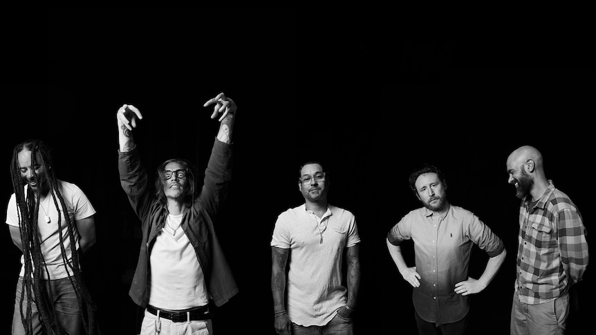 A black and white photo of the five members of Incubus