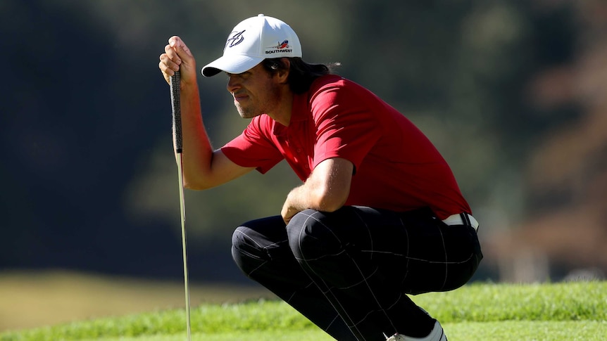 Aaron Baddeley surveys a putt