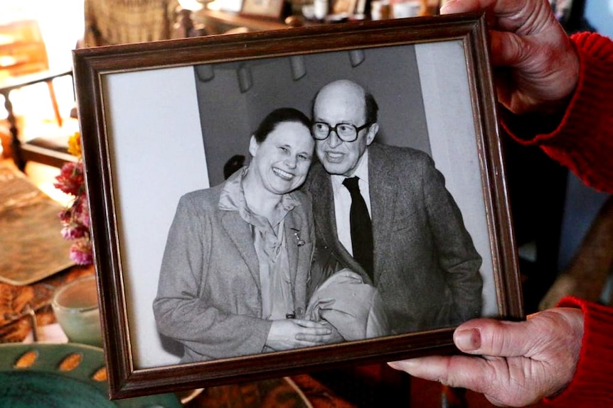 A photo of a framed picture of Barbara McKay with art critic Clement Greenberg.